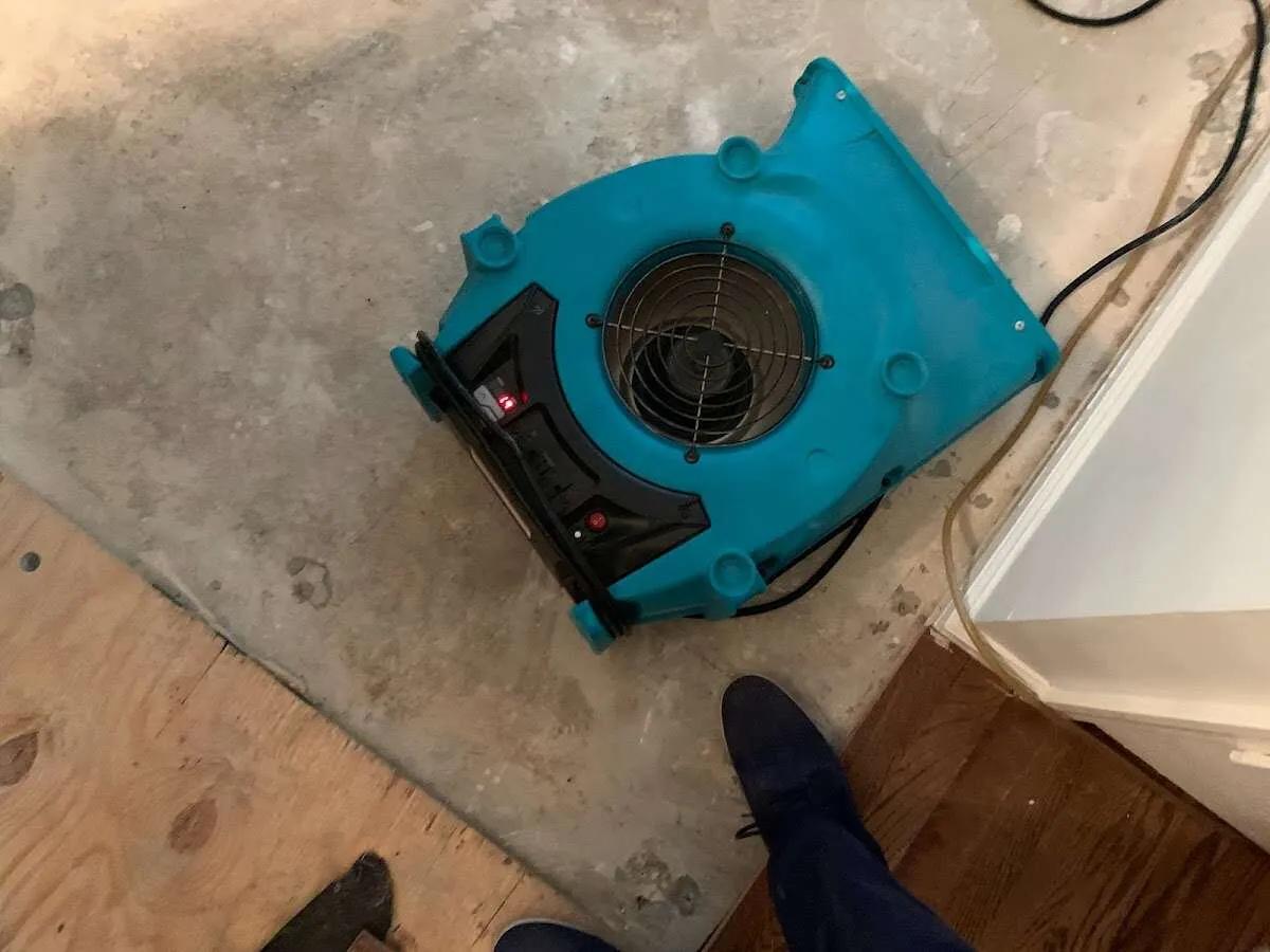 Air mover drying subfloor during Leak Detection & Repair in Santa Clarita